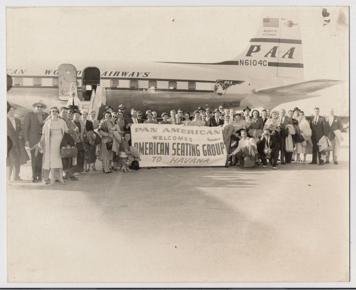 1950s American Seating Group pose for a picture enroute to Havana on a Pan Am DC6 tail number N6104C.